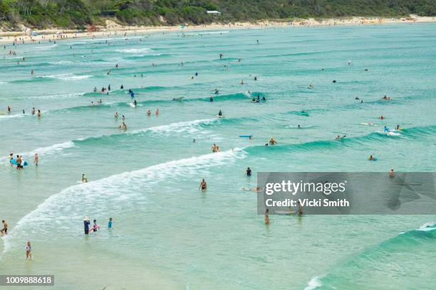 crystal clear waters with swimmers seen from above - australia surfing stock pictures, royalty-free photos & images