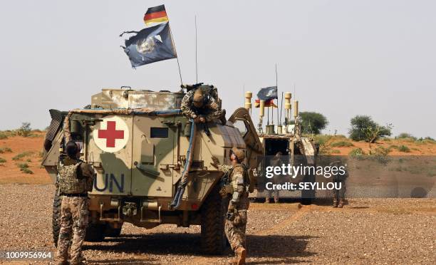 German soldiers from the parachutists detachment of the MINUSMA search for IED during a patrol on the route from Gao to Gossi, Mali on August 2, 2018.