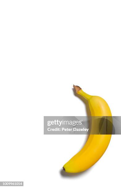 banana on white with copy space - banana stock pictures, royalty-free photos & images