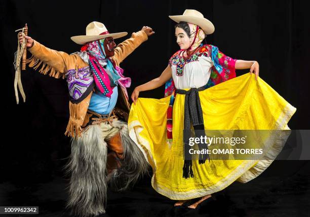 Itavivi Mendez and Jesus Guzman, from Santiago Juxtlahuaca, rehearse the "Dance of the Blondes" for the Guelaguetza traditional festival in Oaxaca,...