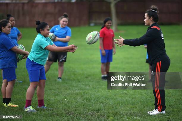 Theresa Fitzpatrick of the Black Ferns leads school children in some basic rugby skills and fitness training during the the New Zealand Black Ferns...