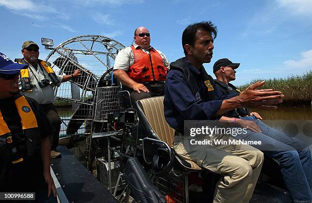 Louisiana Governor Bobby Jindal answers questions during a tour of areas where oil has come ashore May 26, 2010 in Blind Bay, Louisiana. As BP...