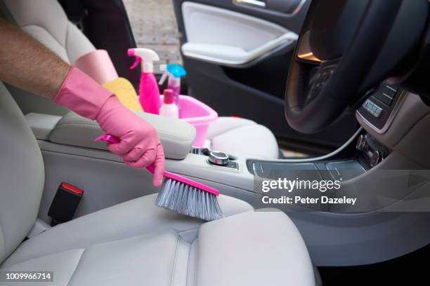 car dealer valeting the car prior to sale - car interior stock pictures, royalty-free photos & images