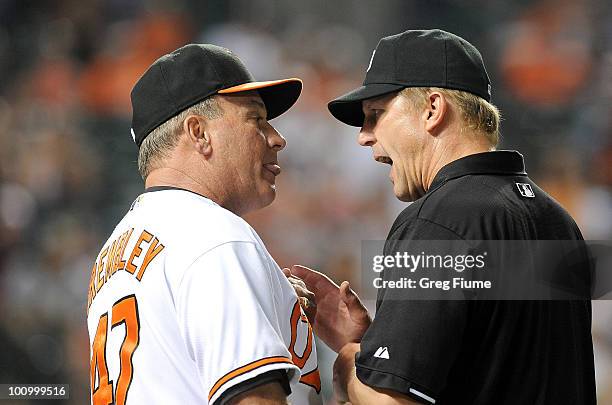 Manager Dave Trembley of the Baltimore Orioles argues a call with third base umpire Jeff Kellogg during the game against the Oakland Athletics at...