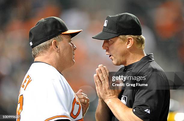 Manager Dave Trembley of the Baltimore Orioles argues a call with third base umpire Jeff Kellogg during the game against the Oakland Athletics at...