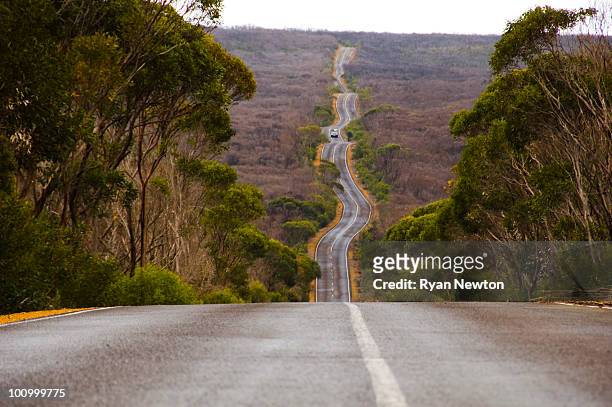long winding road on kangaroo island - kangaroo island australia stock pictures, royalty-free photos & images