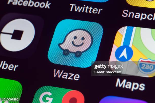 waze, google maps, uber and other apps on iphone screen - google map stock pictures, royalty-free photos & images