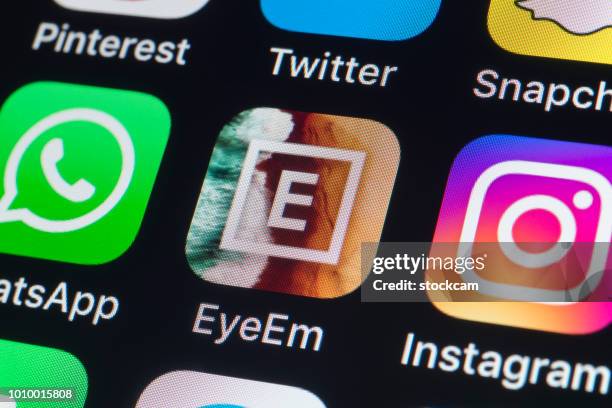 eyeem, whatsapp, instagram and other phone apps on iphone screen - eyeem stock pictures, royalty-free photos & images