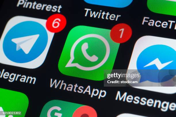 whatsapp, messenger, telegram and other phone chat apps on iphone screen - whatsapp stock pictures, royalty-free photos & images