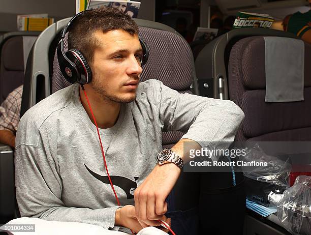 Nikita Rukavytsya of the Australian Socceroos relax in-flight en route to Johannesburg in South Africa for the 2010 FIFA World Cup on May 26, 2010.