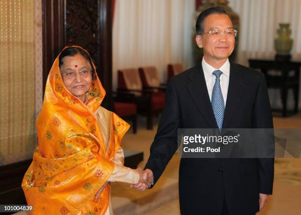 India's President Pratibha Patil shakes hands with with China's Premier Wen Jiabao during a meeting at Zhongnanhai on May 27, 2010 in Beijing, China....