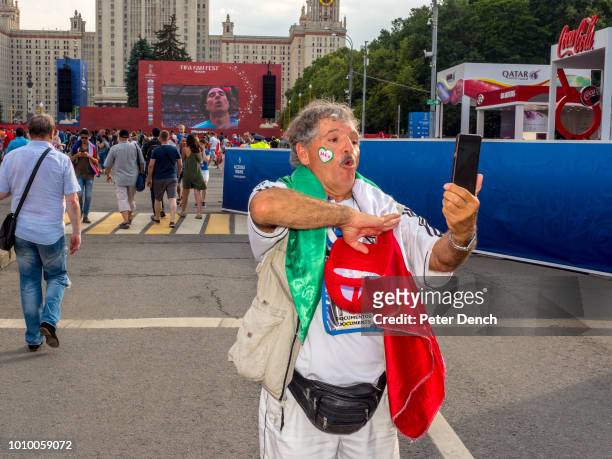 Mexico fan joins in the national anthem at the FIFA Fan Fest located at Vorobyovy Gory Moscow, with a venue capacity of 25,000. The site provides a...
