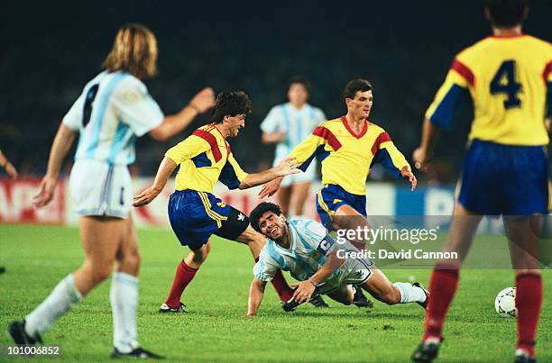 Diego Maradona of Argentina is fouled by Iosif Rotariu of Romania during their Group B match of the 1990 FIFA World Cup match on 18 June 1990 in the...