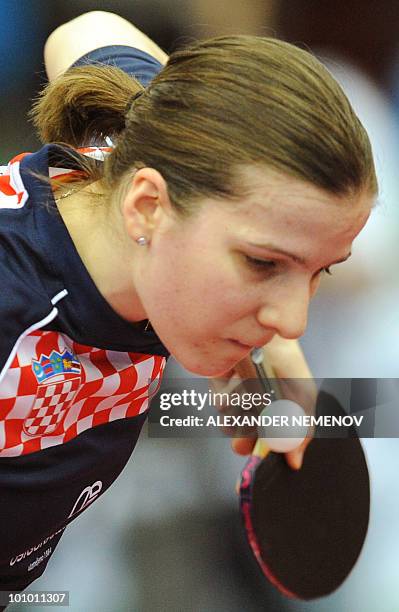 Croatian Andrea Bakula returns a serve to Korean Park Mi Yung during their women's 1/8 final match at the 2010 World Team Table Tennis Championships...
