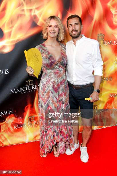 German actress Monica Ivancan and her husband Christian Meier attend the Remus Lifestyle Night on August 2, 2018 in Palma de Mallorca, Spain.