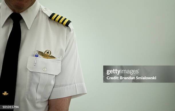 Pilot waits outside a hearing room during a hearing of the Senate Judiciary Committee on Capitol Hill May 27, 2010 in Washington, DC. The committee...