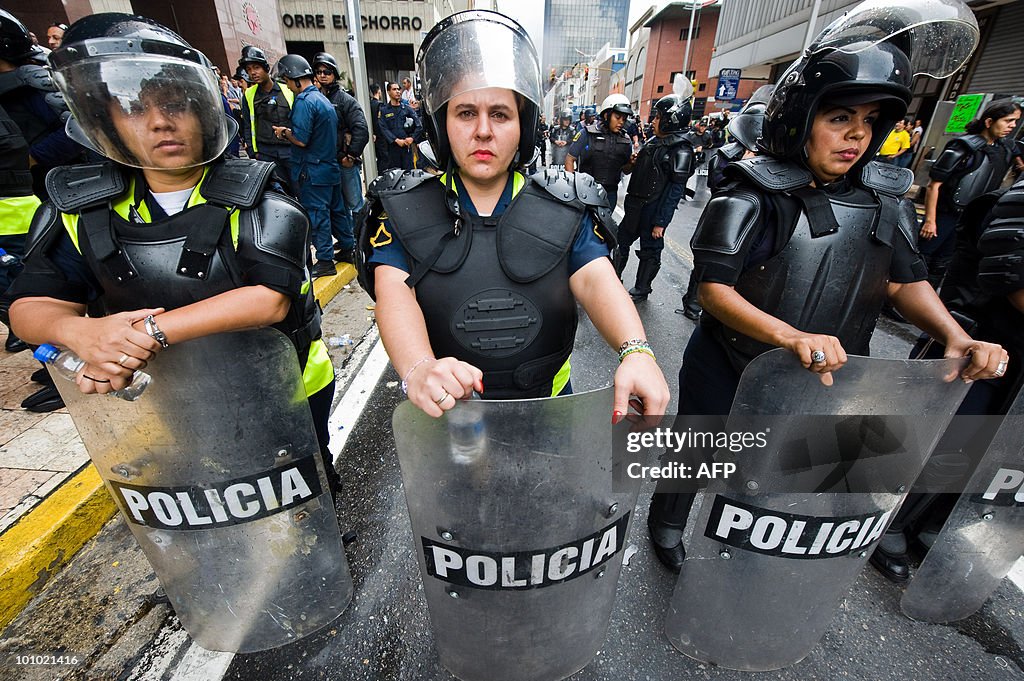 Policewomen stand guard during a protest