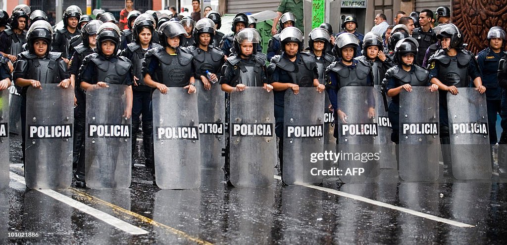 Policewomen stand guard during a protest