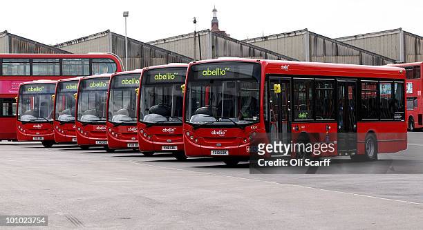 Line of single-decker Abellio London buses are parked in Battersea Bus Depot on May 17, 2010 in London, England. New Routemaster double-decker buses,...