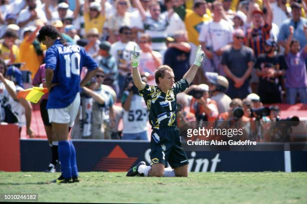 Roberto Baggio of Italy looks dejected and Claudio Taffarel of Brazil celebrate during the 1994 FIFA World Cup final match between Brazil and Italy...