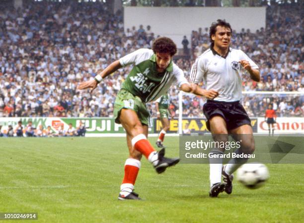 Lakhdar Belloumi of Algeria and Felix Magath of Germany RF during the World Cup match between Germany RF and Algeria at El Molinon, Gijon, Spain on...