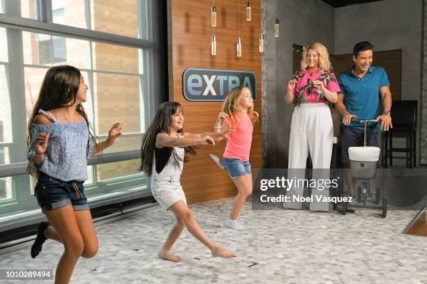 Meghan Trainor and Mario Lopez watch Gia Francesca Lopez and her friends perform "Extra" at Universal Studios Hollywood on July 27, 2018 in Universal...