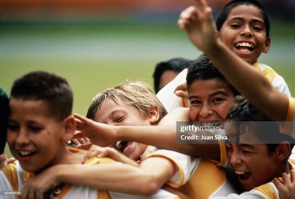 YOUNG SOCCER PLAYERS CELEBRATE, BOYS IN VENEZUELA