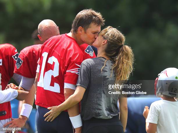 New England Patriots quarterback Tom Brady gets a kiss from his wife Gisele Bundchen following Patriots training camp at the Gillette Stadium...