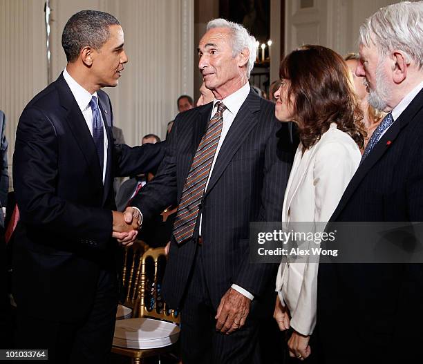 President Barack Obama greets former baseball player Sandy Koufax, as Jane Clarke and Theodore Bikel look on during a reception in honor of Jewish...