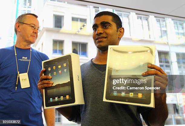 Self-confessed Apple fanatic Rahul Koduri puchases the first iPad in Australia at the Apple store on George Street on May 28, 2010 in Sydney,...