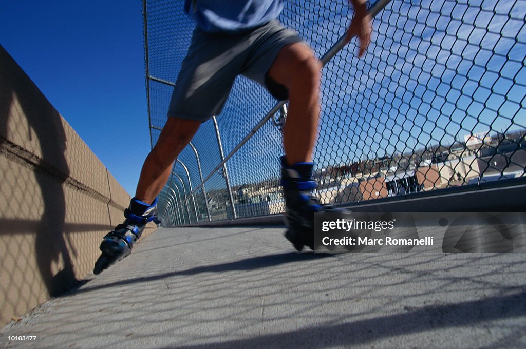 INLINE SKATER ON BRIDGE IN ALBUQUERQUE, NEW MEXICO