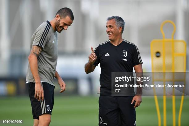 Leonardo Bonucci of Juventus and Aldo Dolcetti talk during a training session at JTC on August 3, 2018 in Turin, Italy.
