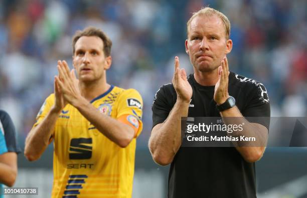 Stephan Fuerstner of Braunschweig and head coach Henrik Pedersen show their frustration after loosing the 3.Liga match between FC Hansa Rostock and...