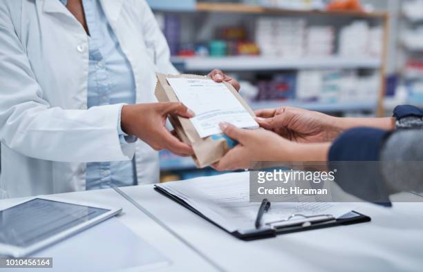 your prescription is ready for collection - pharmacy imagens e fotografias de stock