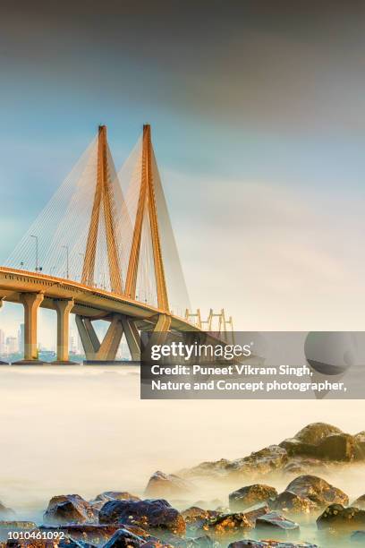 bandra worli sea link of mumbai during sunset - mumbai india stock pictures, royalty-free photos & images