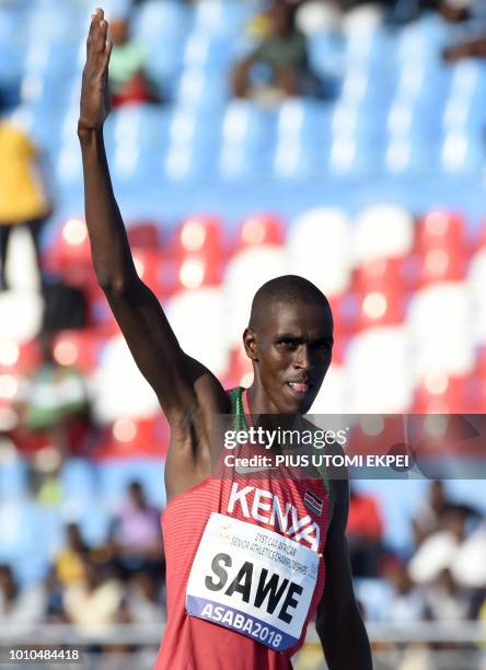 Kenya's Mathew Sawe celebrates winning gold during the Men's long jump final at the African Senior Athletics Championship at Stephen Keshi Stadium in...