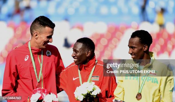 Gold medalist Kenya's Conseslus Kipruto , silver medalist Morocco's Bakkali Soufiane and bronze medalist Ethiopia's Getnet Wale Bayabl pose during...