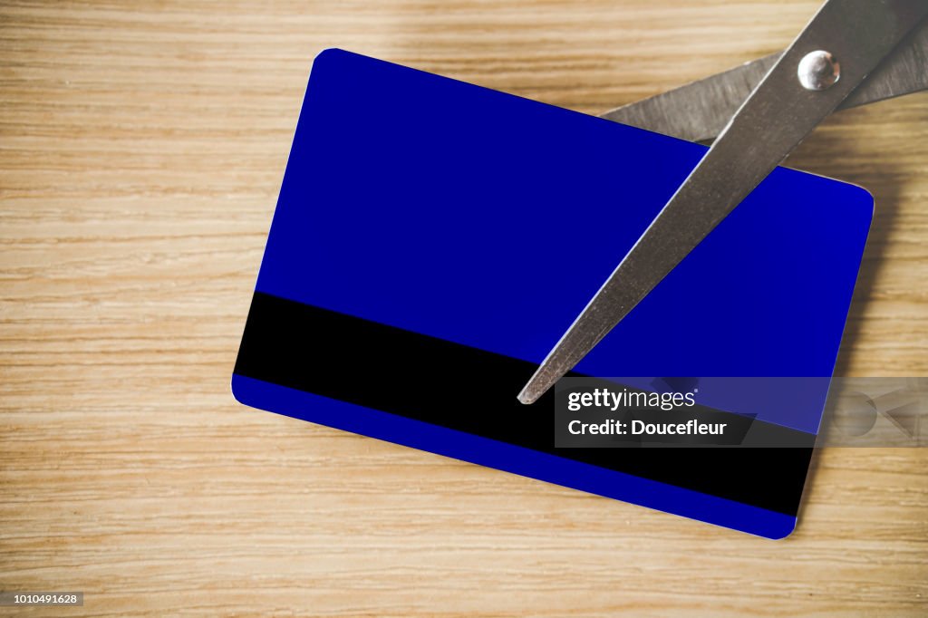 Free debt concept with scissors cutting credit card