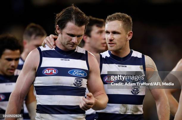Joel Selwood of the Cats chats to Patrick Dangerfield of the Cats as they leave the field at half time during the 2018 AFL round 20 match between the...