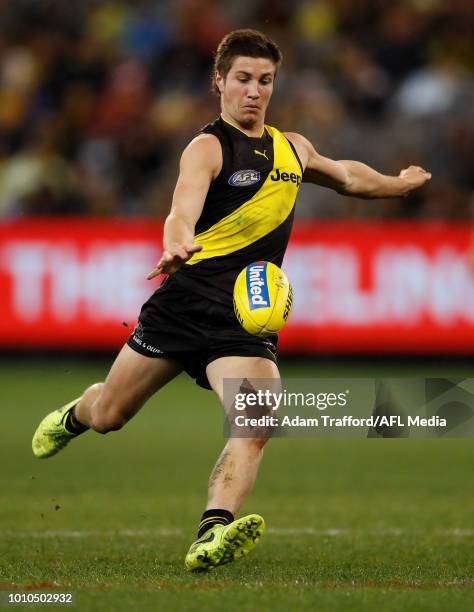 Liam Baker of the Tigers kicks the ball during the 2018 AFL round 20 match between the Richmond Tigers and the Geelong Cats at the Melbourne Cricket...