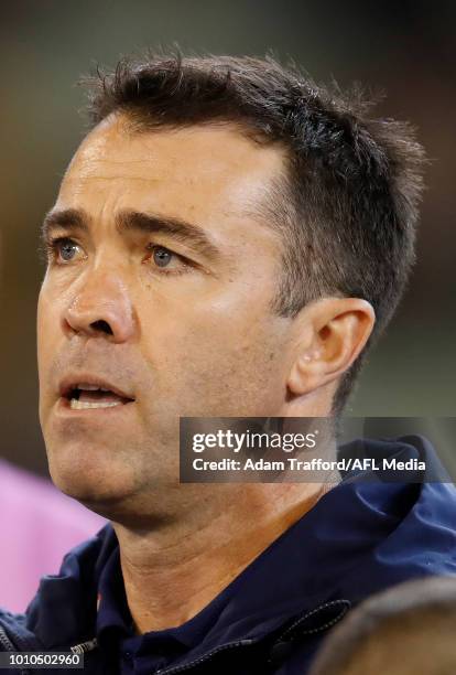 Chris Scott, Senior Coach of the Cats addresses his players during the 2018 AFL round 20 match between the Richmond Tigers and the Geelong Cats at...