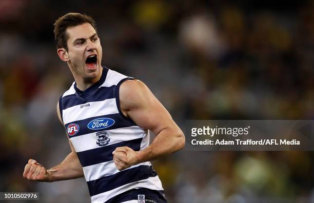 Daniel Menzel of the Cats celebrates a goal during the 2018 AFL round 20 match between the Richmond Tigers and the Geelong Cats at the Melbourne...
