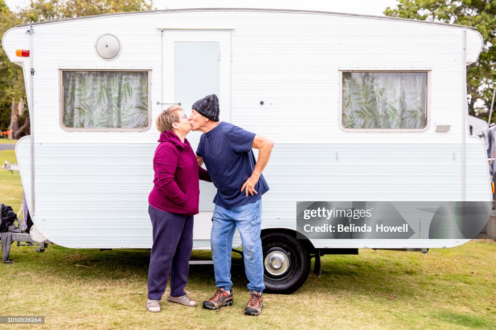 Grandparents with grandkids at campground with their caravan