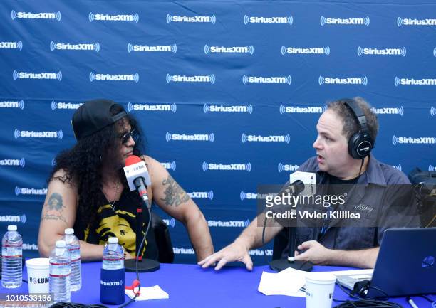 Slash and Eddie Trunk attend SiriusXM Volume Presents Eddie Trunk Live at The Rainbow on August 3, 2018 in Los Angeles, California.