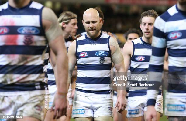 Gary Ablett of the Cats and his teammates leave the field after losing the round 20 AFL match between the Richmond Tigers and the Geelong Cats at...