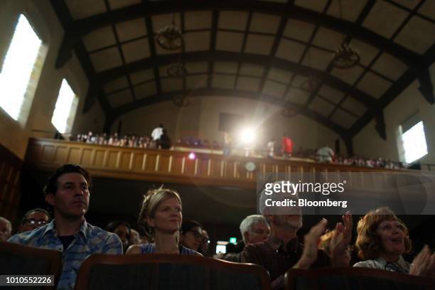 Attendees listen and applaud as Alexandria Ocasio-Cortez, a Democratic U.S. Representative candidate from New York, not pictured, speaks during an...