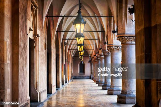renaissance corridor in cloth hall sukiennice on the main market square, krakow, poland - krakow stock pictures, royalty-free photos & images