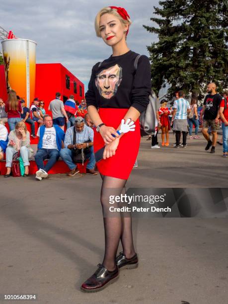 Russian football fan with a T-Shirt featuring Vladimir Putin, the former intelligence officer serving as President of Russia since 2012, previously...
