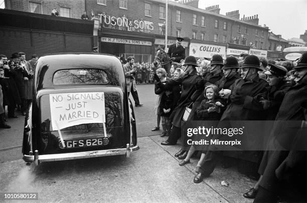 The wedding of Marty Wilde and Joyce Baker, held at Christ Church in Greenwich. Fans are held back by Police, 2nd December 1959.