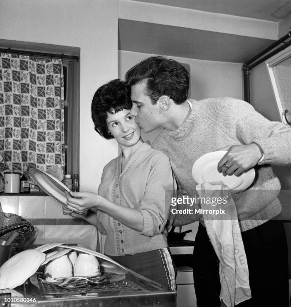 Rock 'n' Roll singer Marty Wilde and his fiance Joyce Baker making last minute arrangements at the home of Marty's parents in Greenwich, ahead of...